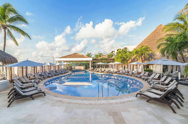 Pool and tropical grounds at Desire Riviera Maya