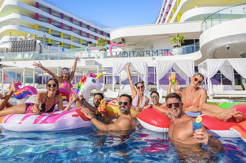 Friends laughing together in the pool at Temptation Cancun